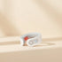 PulseFlex Massager product photo on a warm beige background