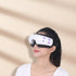 EyeWarm Smart Massager product photo on a warm beige background